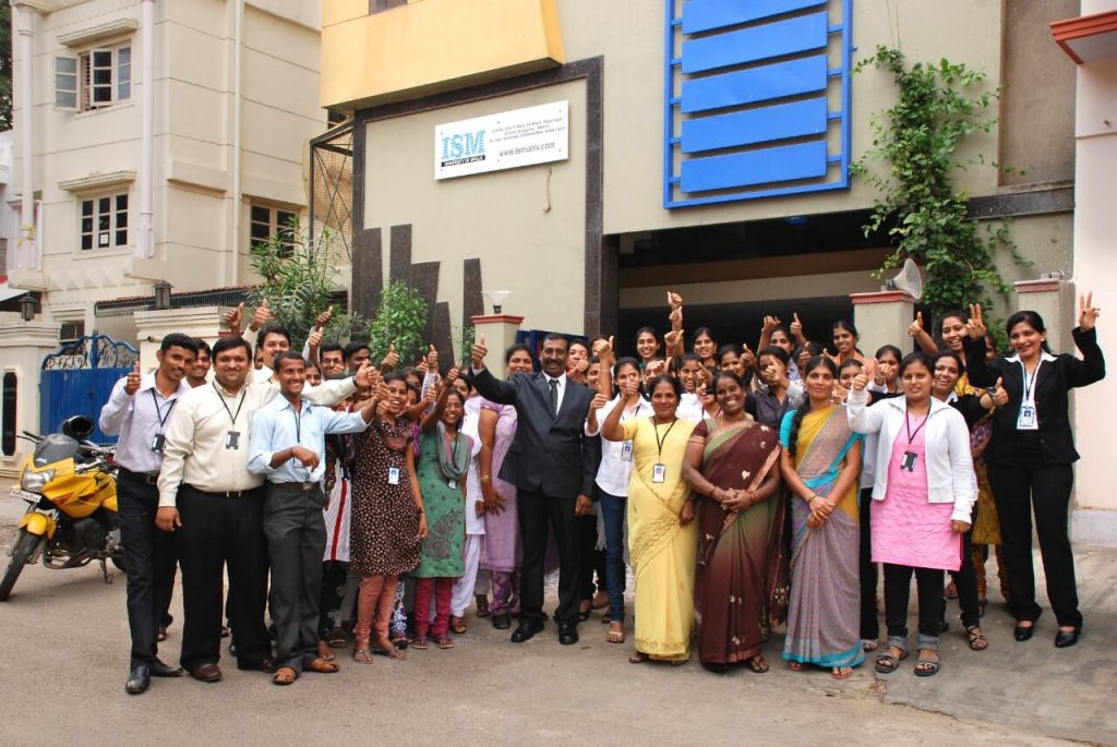 Staff and building photo of ISM UNIV Bangalore