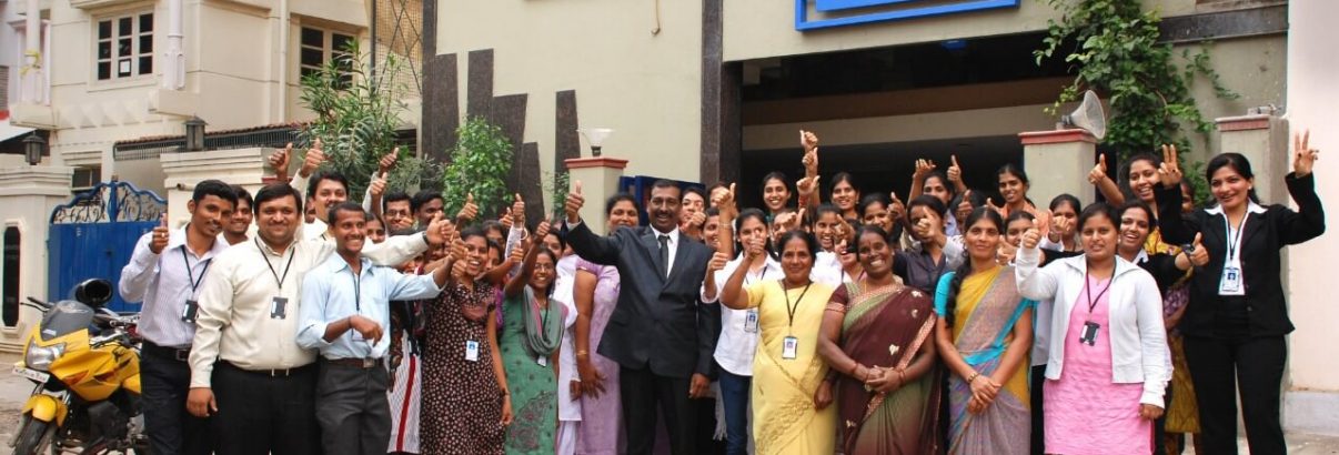 Staff and building photo of ISM UNIV Bangalore