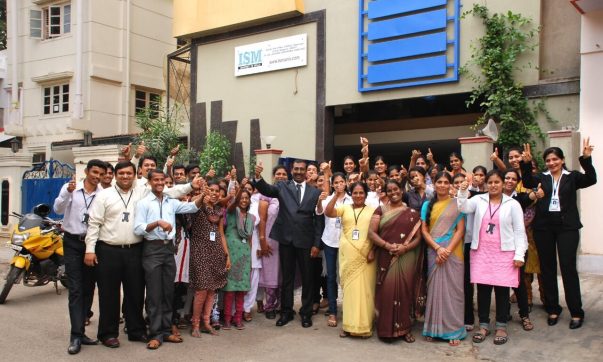 Staff and building photo of ISM UNIV Bangalore