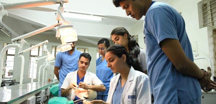 Students of SDM College of Dental Sciences practicing