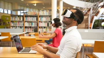 adult-male-student-with-vr-simulator-library