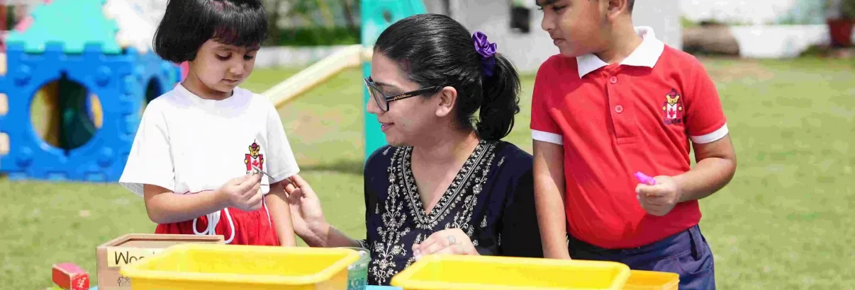 image of teacher interaction with students at Maple Bear Canadian Pre-School