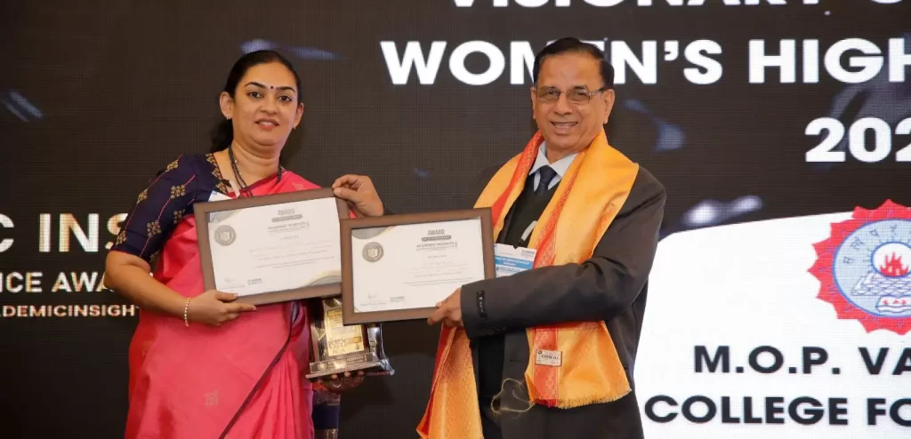 image of Dr. Archna Prasad, Principal of M.O.P. Vaishnav College for Women, receiving awards