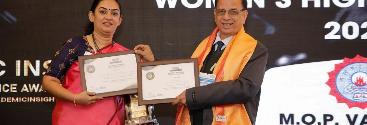 image of Dr. Archna Prasad, Principal of M.O.P. Vaishnav College for Women, receiving awards