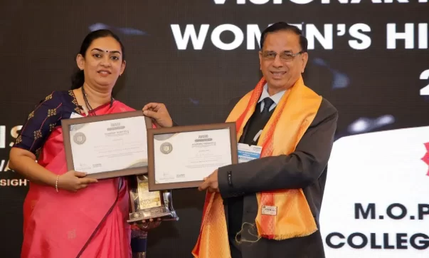 image of Dr. Archna Prasad, Principal of M.O.P. Vaishnav College for Women, receiving awards