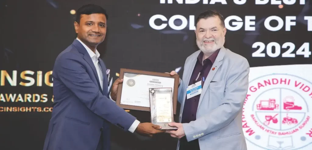 image of Dr. Pradeep G L, the Principal of MGV’s KBHDCH, receiving the award