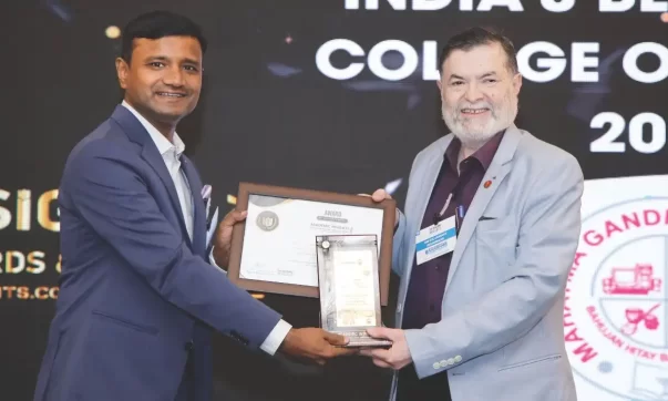 image of Dr. Pradeep G L, the Principal of MGV’s KBHDCH, receiving the award