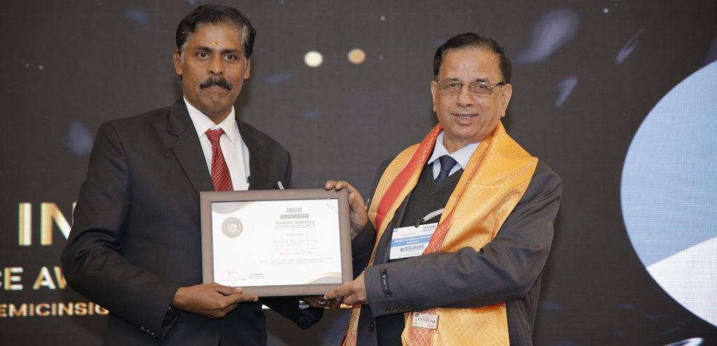 Menakath Sripadam Sreesan, the Principal of Yajnavalkya Public School (CBSE), receiving the 'Educator of the Year 2024' award at the Academic Insights Education Excellence Awards & Summit 2024