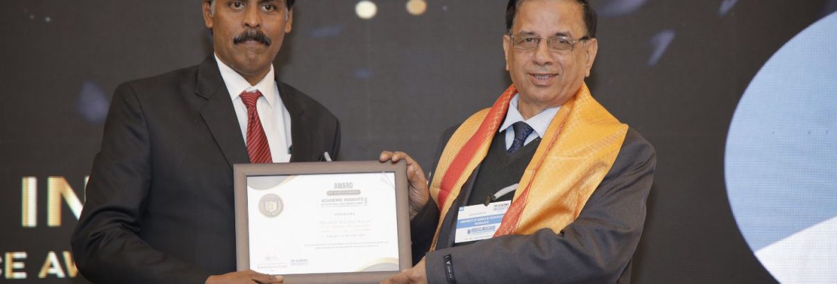 Menakath Sripadam Sreesan, the Principal of Yajnavalkya Public School (CBSE), receiving the 'Educator of the Year 2024' award at the Academic Insights Education Excellence Awards & Summit 2024