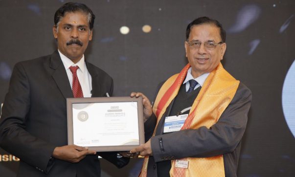 Menakath Sripadam Sreesan, the Principal of Yajnavalkya Public School (CBSE), receiving the 'Educator of the Year 2024' award at the Academic Insights Education Excellence Awards & Summit 2024