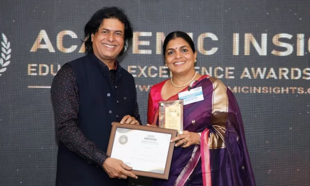 Ms. Liju P. Alex, Principal of National Hill View Public School, Banashankari receiving the award at the Academic Insights Education Excellence Awards and Summit 2024