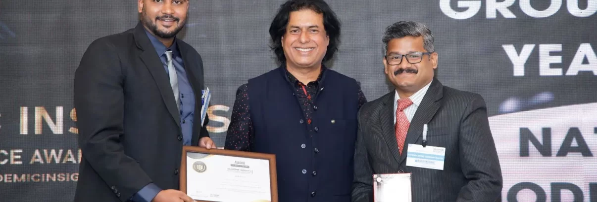 Mr. Rahidh A W, the Outreach Manager and Mr Ramesh Chandran, the Coordinator at National Model Sr Sec School receiving the award at the Academic Insights Education Excellence Awards & Summit 2024