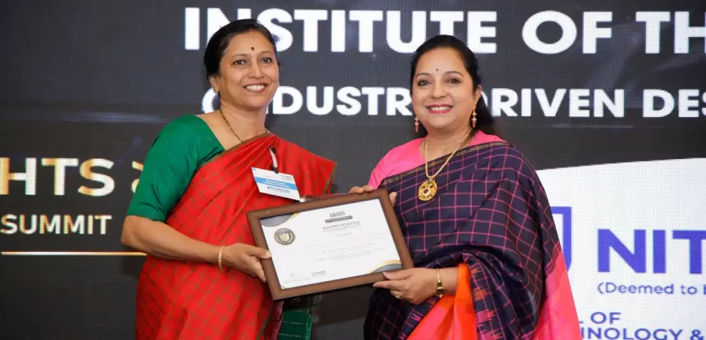 image ofDr. Sandhya Ravi, the Principal of NSFTID receiving the award