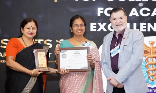 image of Dr Jayanthi V, the Vice-Chancellor, and Dr Renuka Venkatesh, the Principal and Dean of SIMS & RC receiving the award