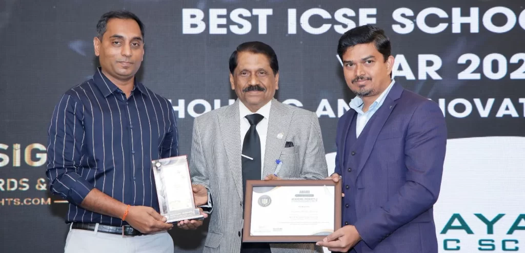Venkat Raju, the President of Bagalur Cross Vinayaka Education Society, and Rasheed Mohammad, the Principal of Vinayaka Public School, receiving the award at the Academic Insights Education Excellence Awards & Summit 2024