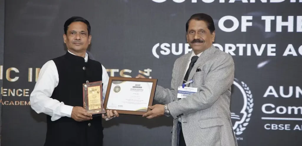 Dr. Rabin Chandra Pramanik, the Chief Adviser of Aum Valley School, receiving the award at the Academic Insights Education Excellence Awards & Summit 2024.