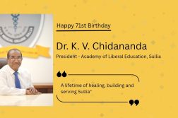 Dr. K. V. Chidananda, President of the Academy of Liberal Education, Sullia, seated at his desk in a white shirt and blue tie, with the text “Happy 71st Birthday” on a yellow background.